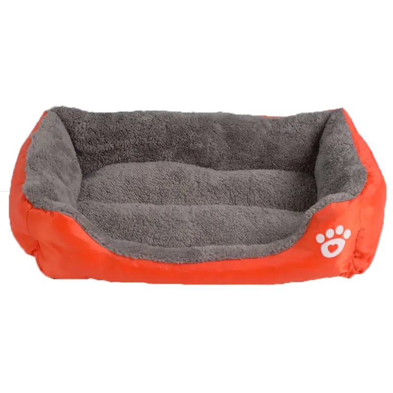 Gekleurd hondenbed in oranje