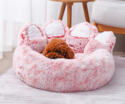 Fluffy berenpoot bed in roze met hond